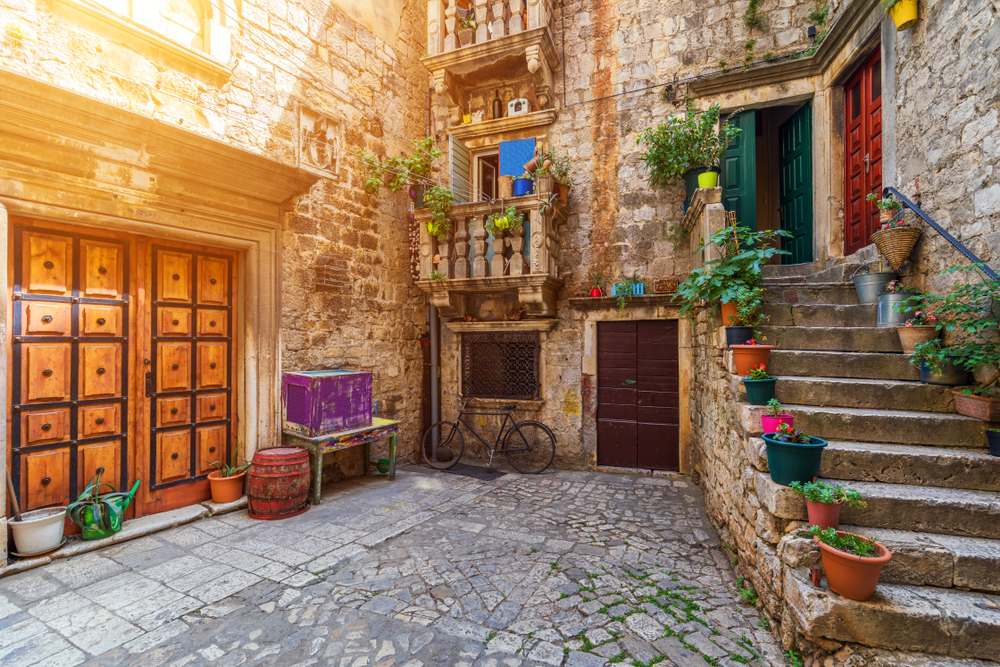 Narrow street in historic town Trogir, Croatia