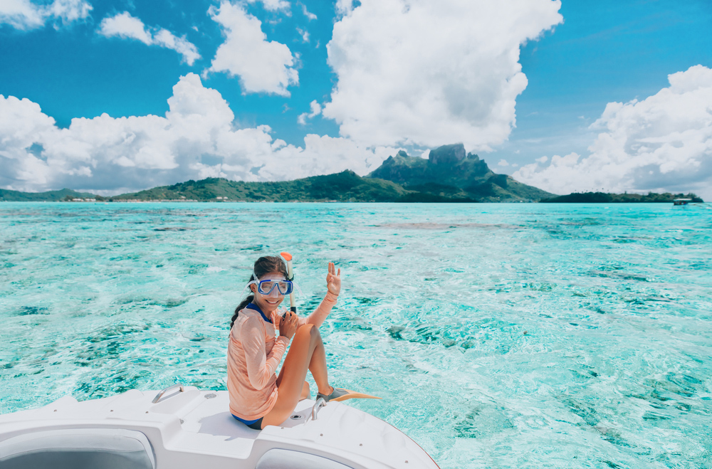 Woman-going-snorkeling-in-Bora-Bora